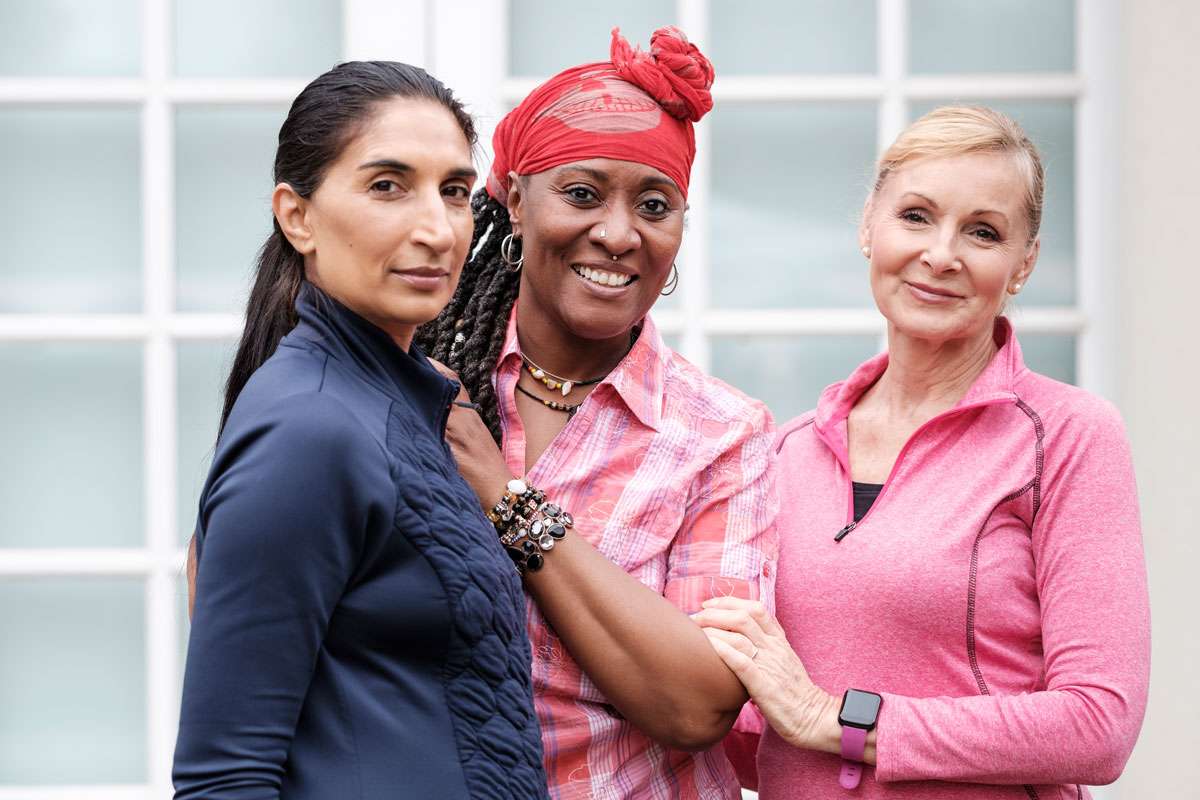 three diverse breast cancer survivors posing for a picture